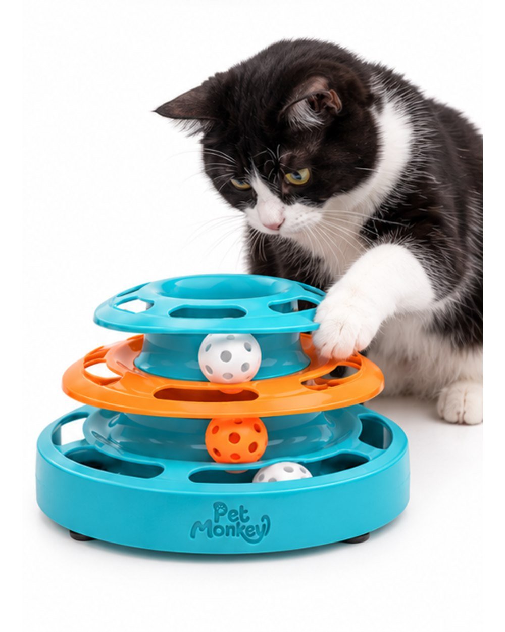 Pet Monkey three-level ball track cat toy with a black and white cat pawing the top level